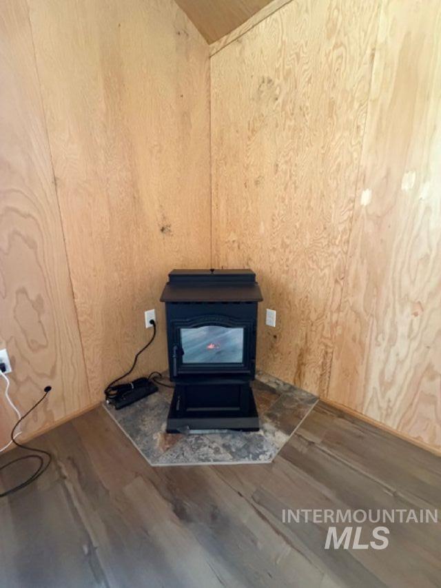 124 Windmill Lane Kooskia, ID 83539 - Photo 46 of 50 Detailed view of wood finished floors and a wood stove