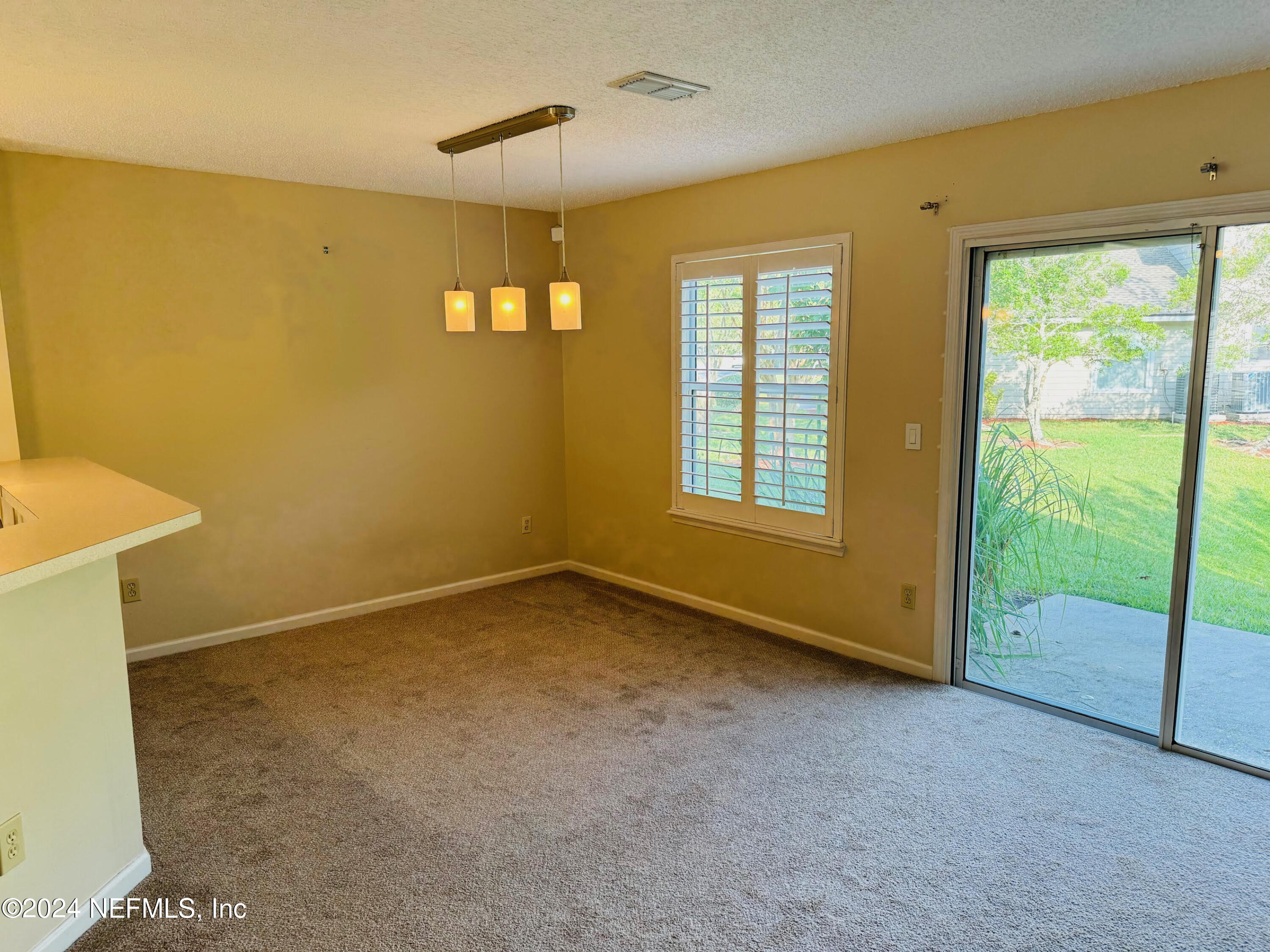 305 Blue Lake Road, Unit 2 St. Johns, FL 32259 - Photo 11 of 45 a view of an empty room with a window