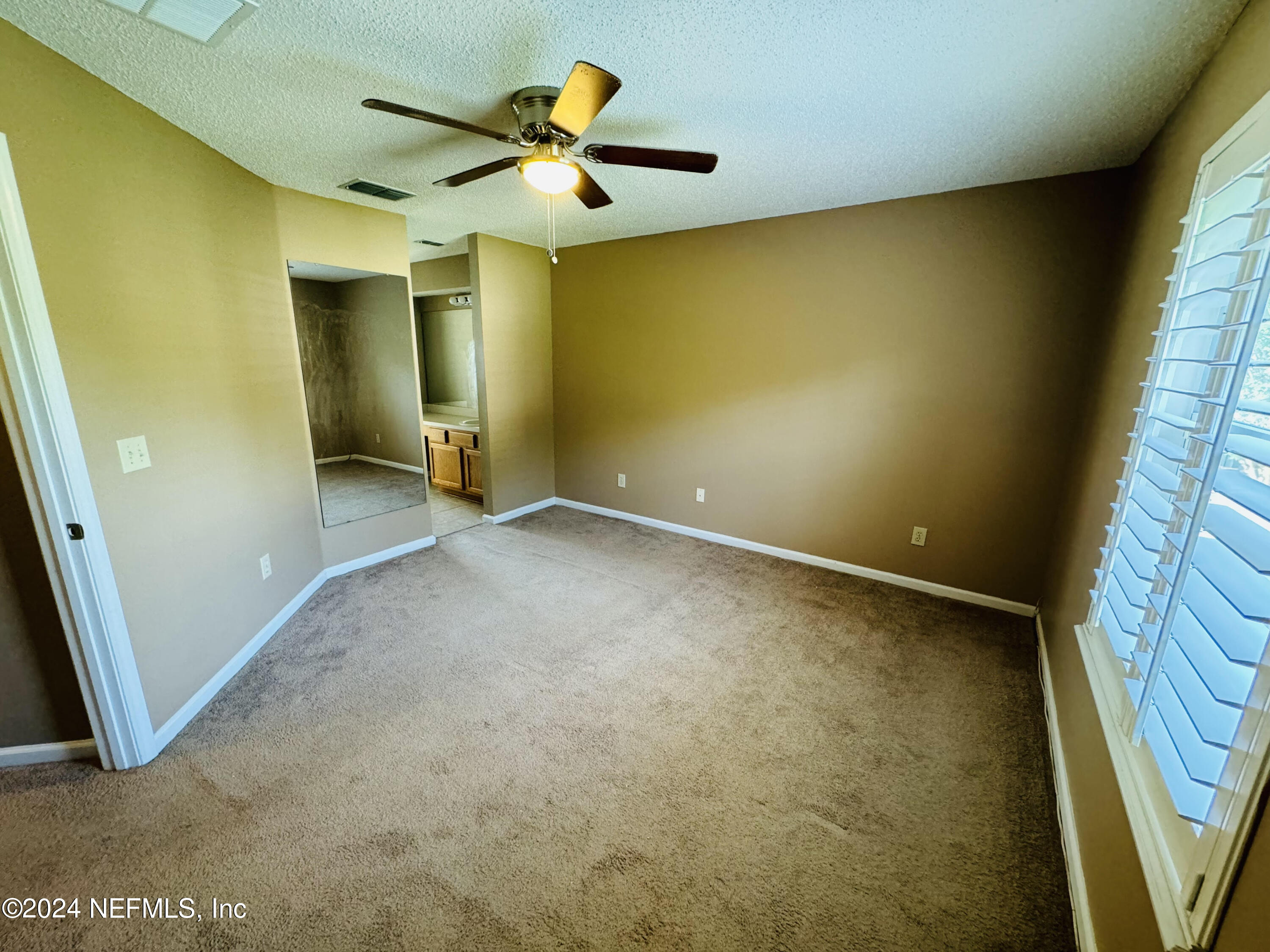 305 Blue Lake Road, Unit 2 St. Johns, FL 32259 - Photo 19 of 45 an empty room with a window