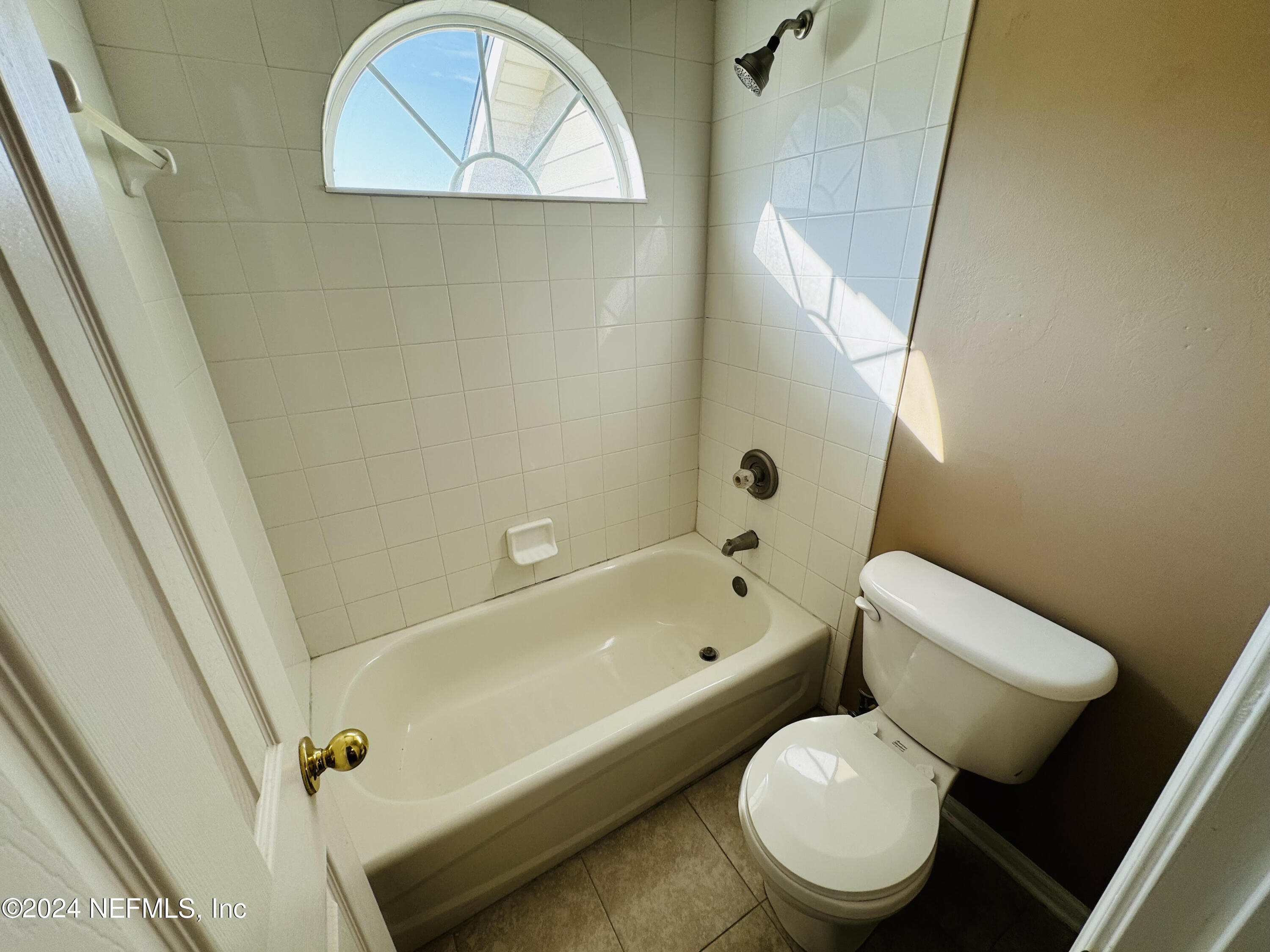 305 Blue Lake Road, Unit 2 St. Johns, FL 32259 - Photo 21 of 45 a white toilet sitting next to a bath tub