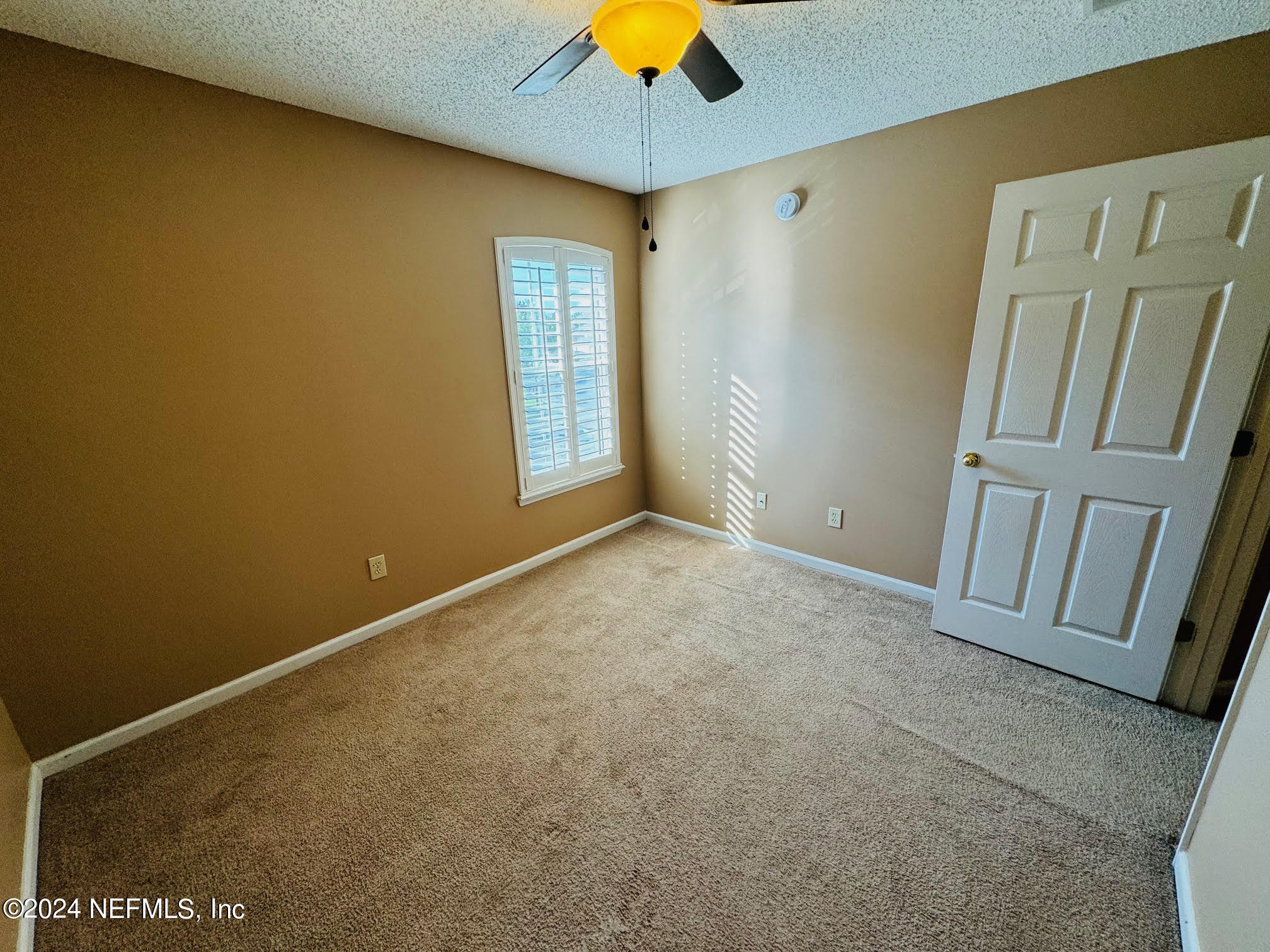 305 Blue Lake Road, Unit 2 St. Johns, FL 32259 - Photo 25 of 45 a view of an empty room with a window