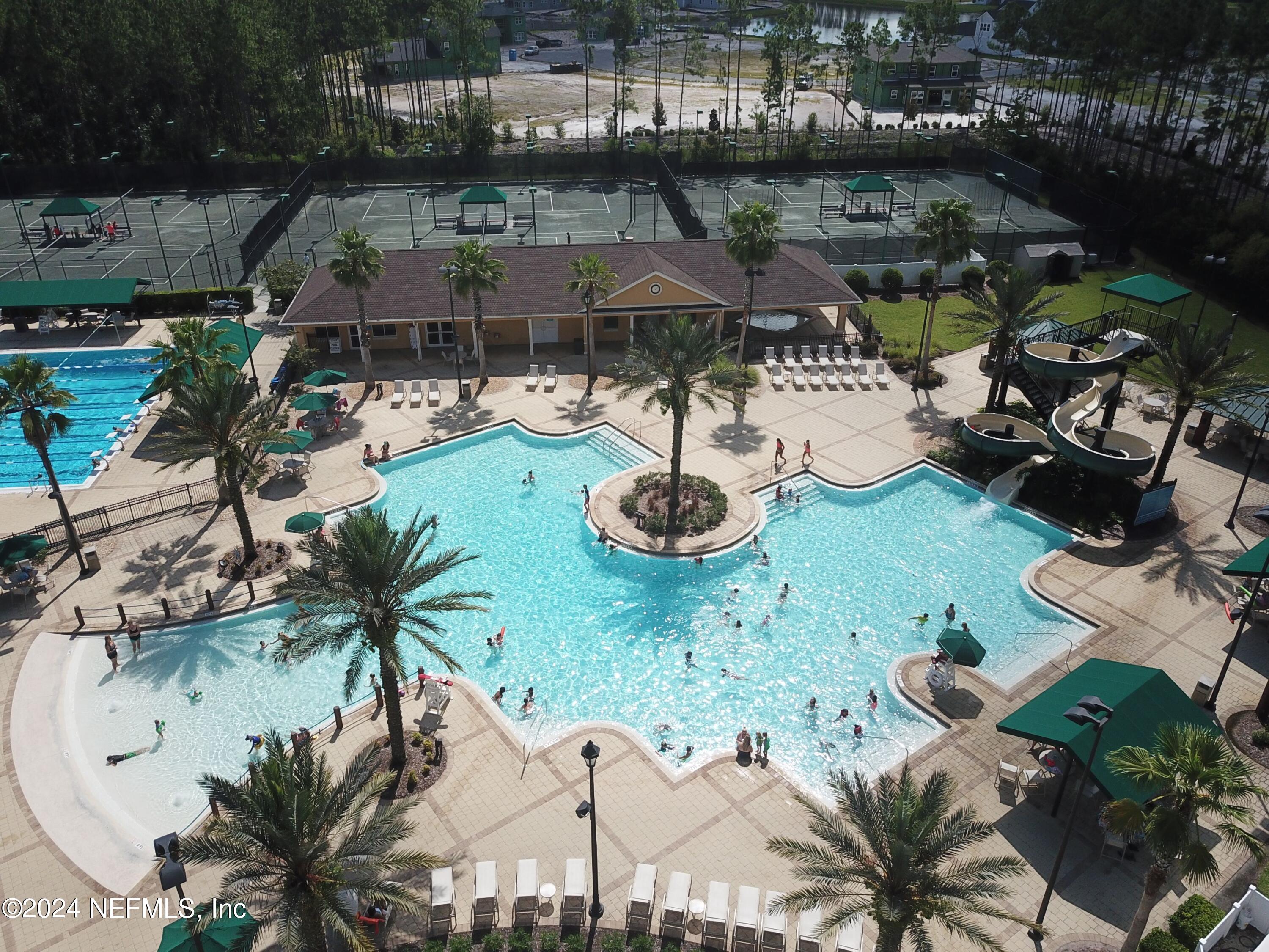 305 Blue Lake Road, Unit 2 St. Johns, FL 32259 - Photo 34 of 45 a picture of a table and chairs in patio