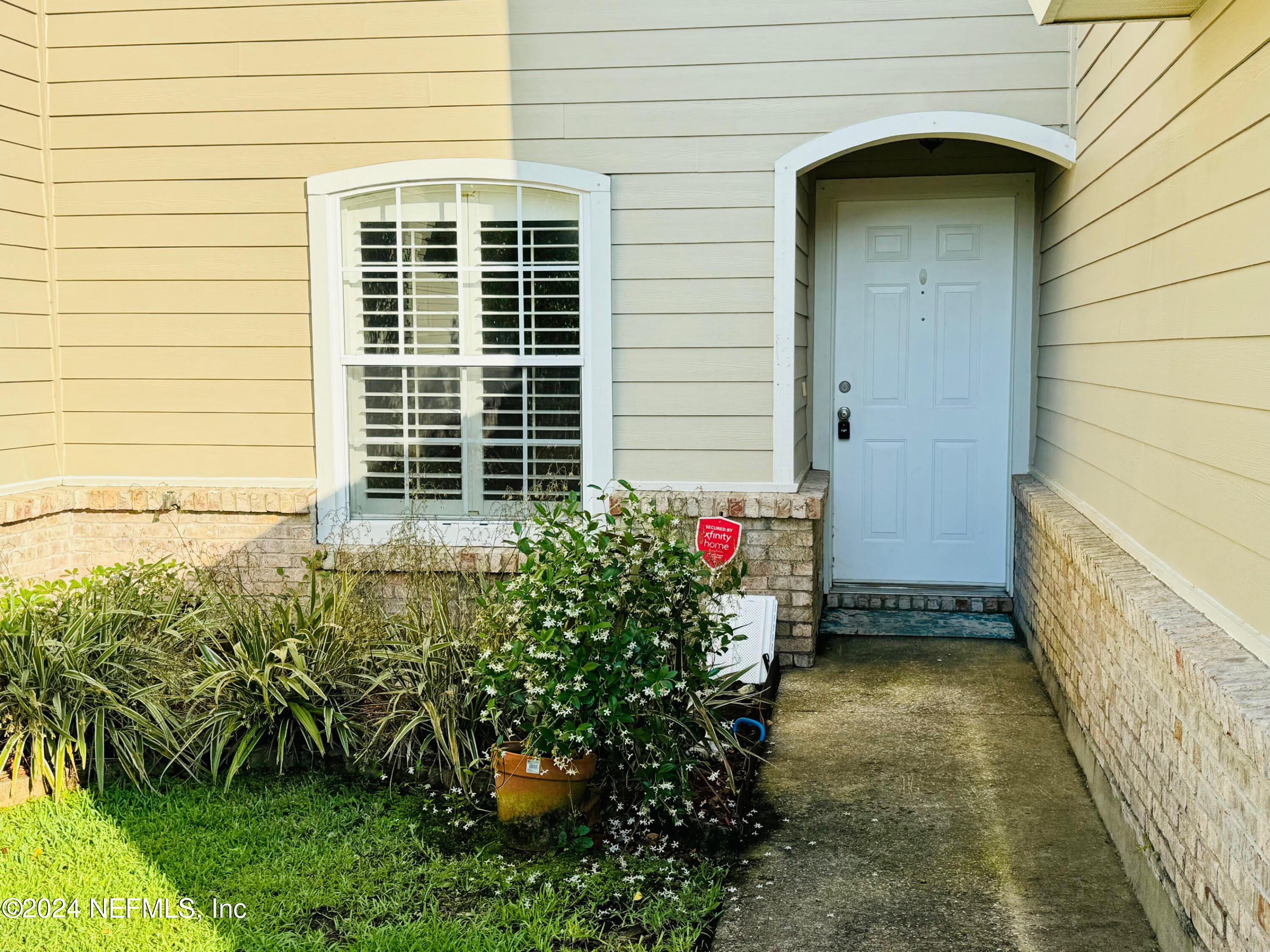 305 Blue Lake Road, Unit 2 St. Johns, FL 32259 - Photo 5 of 45 a view of a house with a flower garden