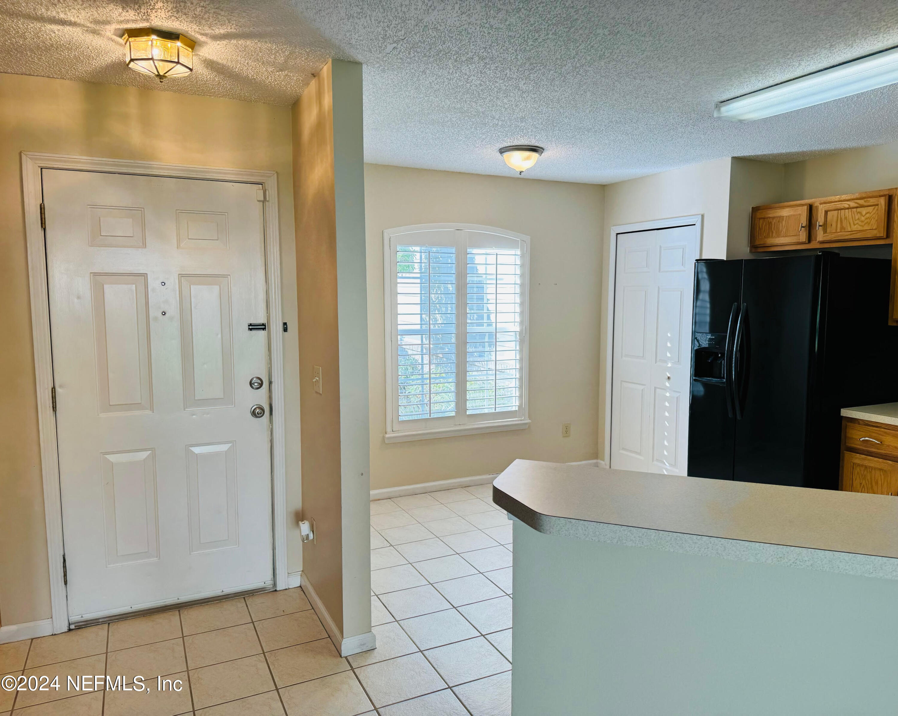305 Blue Lake Road, Unit 2 St. Johns, FL 32259 - Photo 6 of 45 a view of a bathroom with a tub shower and a mirror