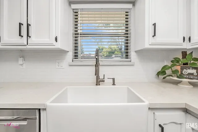 a kitchen with a stove and a sink
