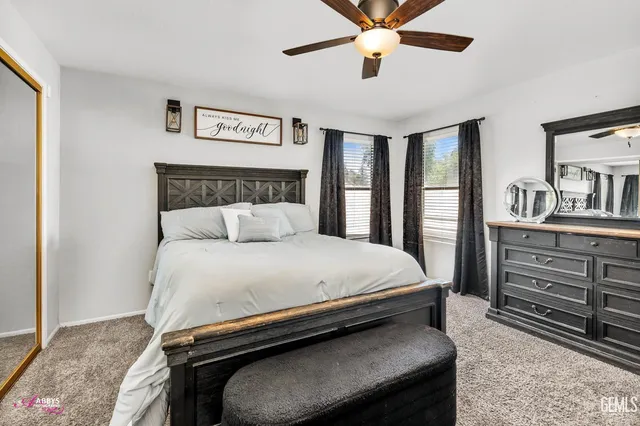 a bedroom with furniture and a window