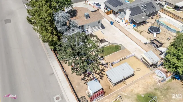 an aerial view of a house with outdoor space