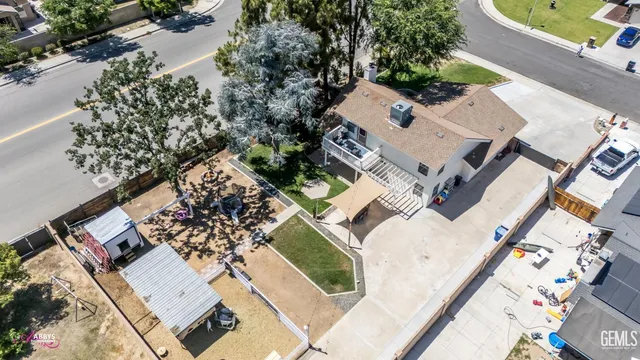 a roof deck with couches and wooden floor