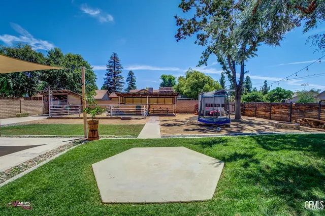 a patio with a table and chairs