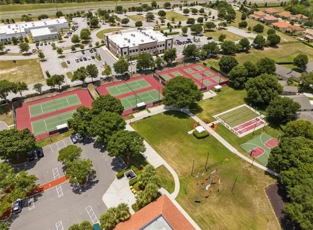 an aerial view of residential houses with outdoor space