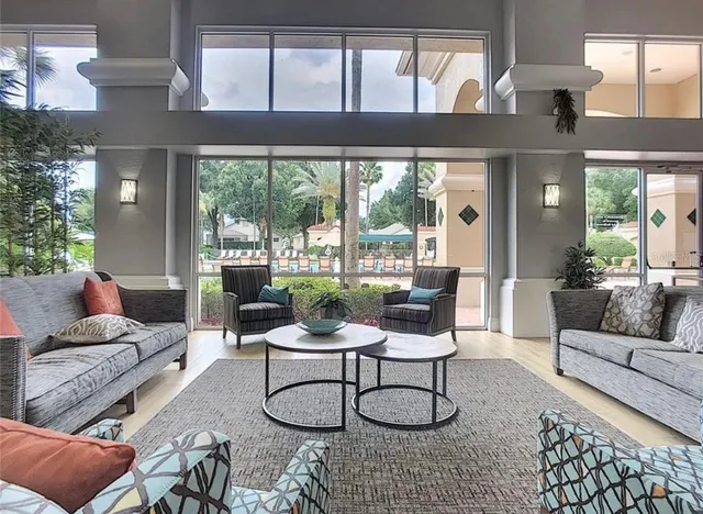 a living room with furniture and a large window