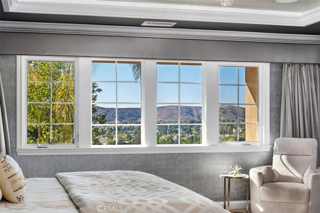 33 Basilica Place Ladera Ranch, CA 92694 - Photo 30 of 61 a living room with a couch and windows