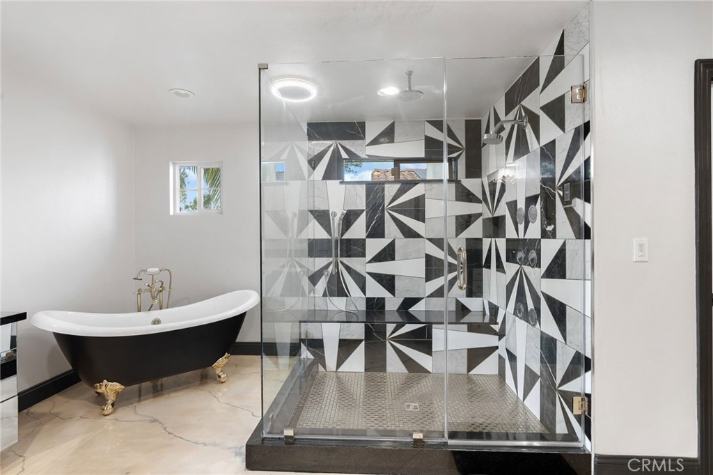 33 Basilica Place Ladera Ranch, CA 92694 - Photo 34 of 61 a living room with chairs and kitchen view
