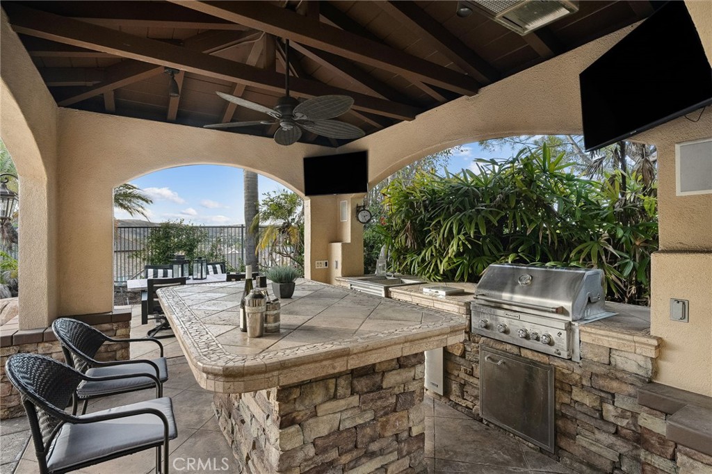 33 Basilica Place Ladera Ranch, CA 92694 - Photo 54 of 61 a view of a patio with a table and chairs