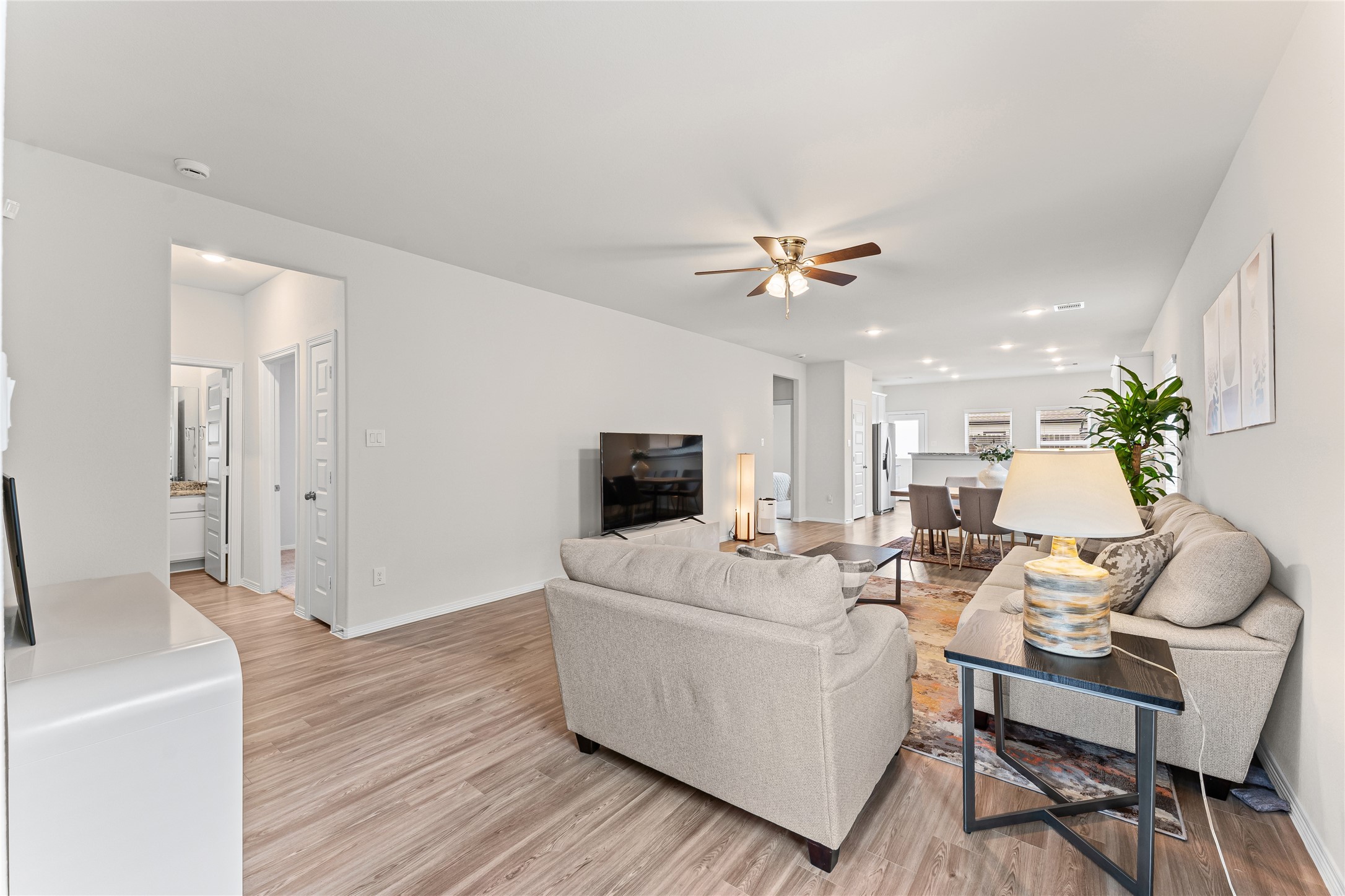 23326 Spring Genesis Lane Katy, TX 77493 - Photo 7 of 32 a living room with furniture and a flat screen tv
