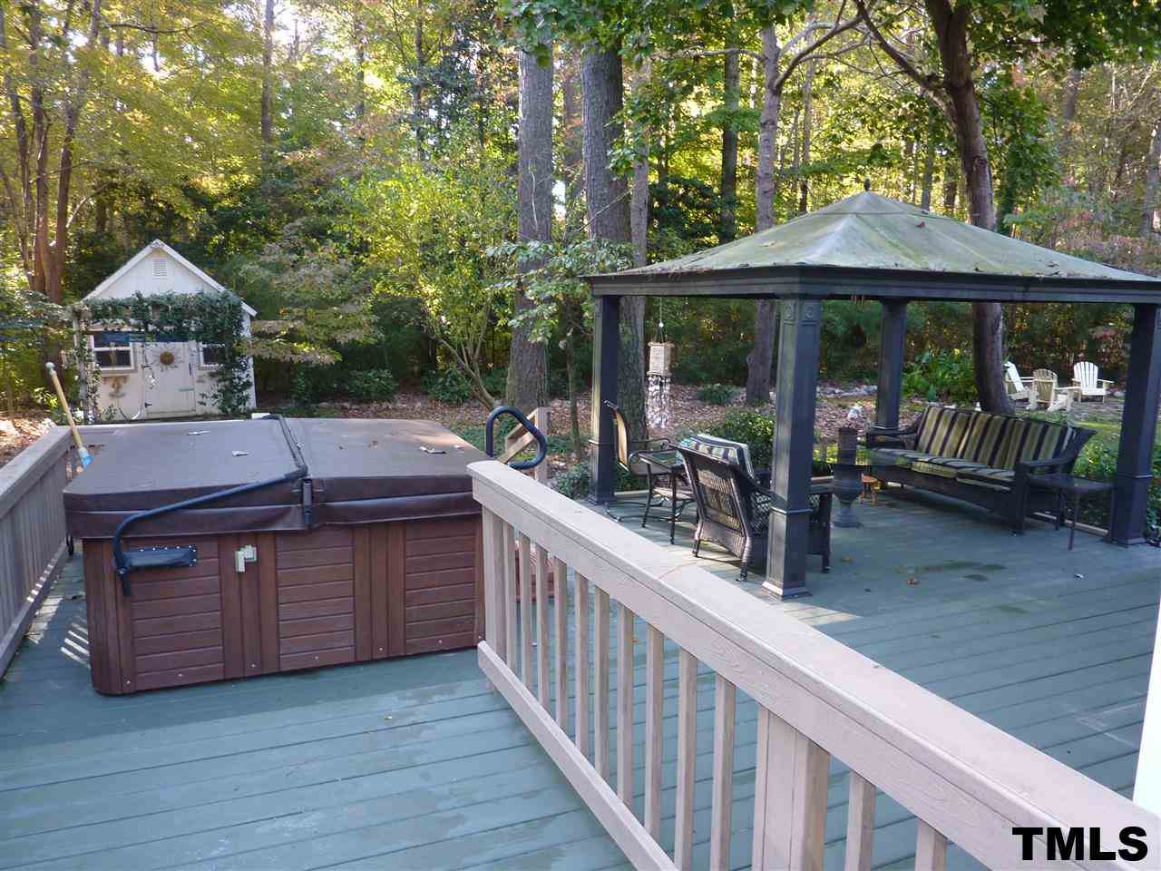 1612 Brook Run Drive Raleigh, NC 27614 - Photo 14 of 15 Enjoy the natural scenery while sitting in the hot tub or sitting area on the 2-tiered deck in the back yard.