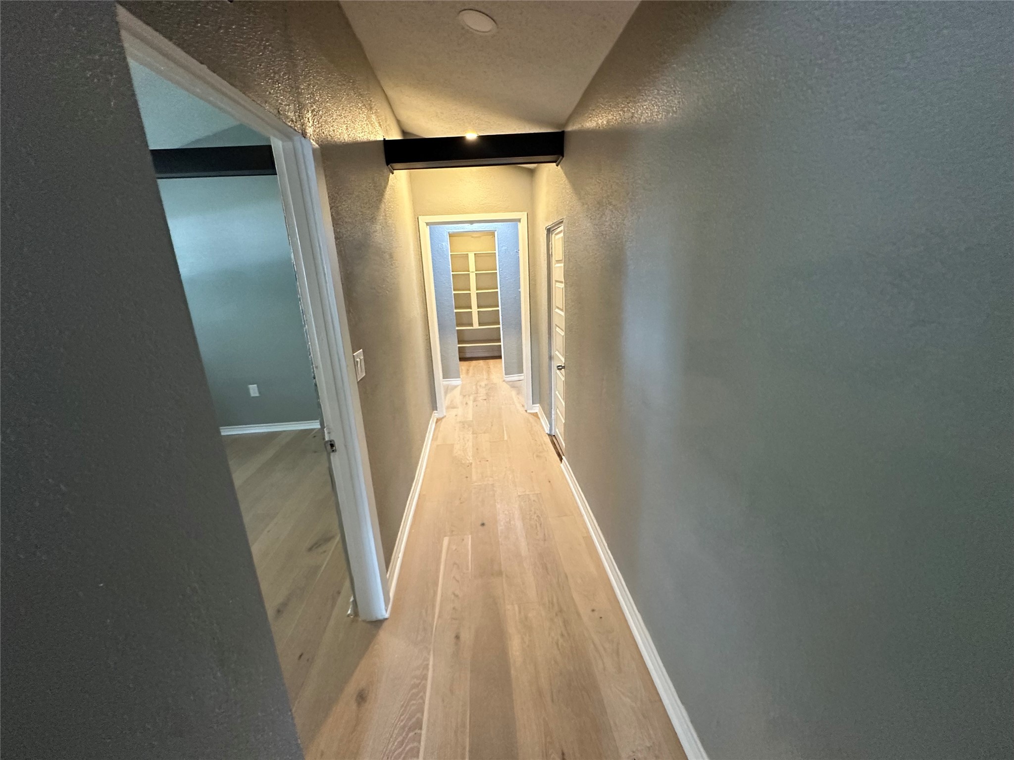 2131 Cromwell Street, Unit D Houston, TX 77093 - Photo 14 of 26 a view of a hallway with wooden floor and staircase