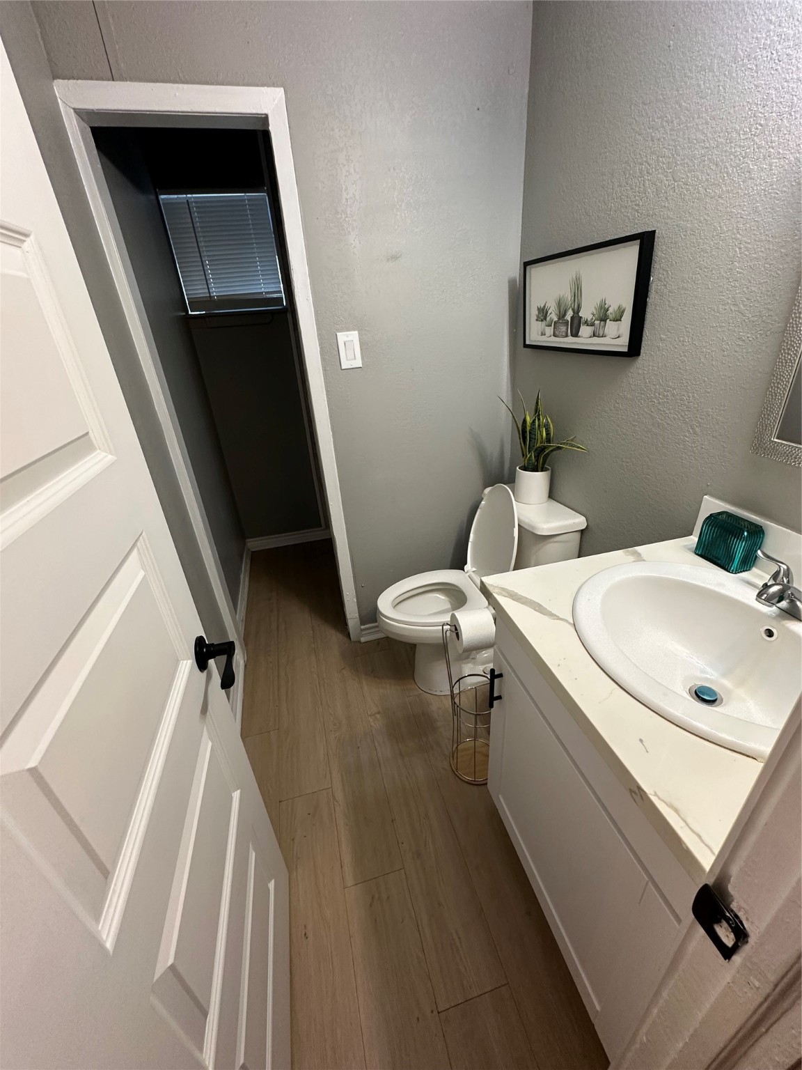 2131 Cromwell Street, Unit D Houston, TX 77093 - Photo 19 of 26 a bathroom with a sink a mirror and a toilet