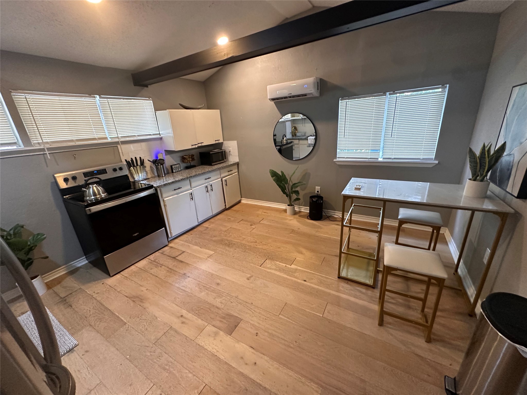 2131 Cromwell Street, Unit D Houston, TX 77093 - Photo 25 of 26 a kitchen with a table chairs and a stove