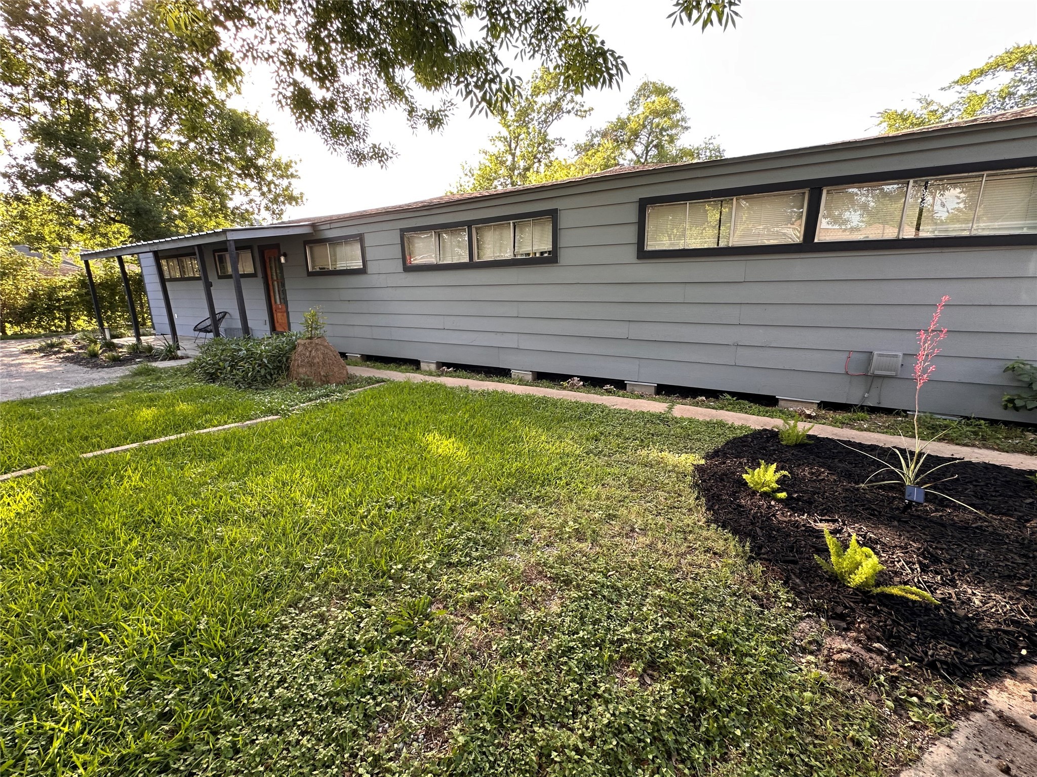 2131 Cromwell Street, Unit D Houston, TX 77093 - Photo 5 of 26 a view of a house with backyard and sitting area