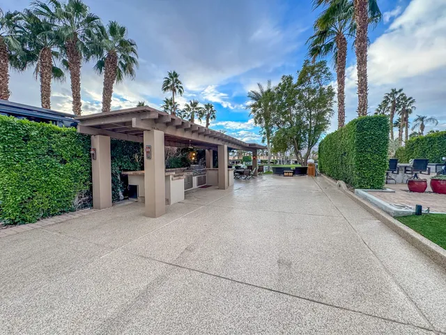 a view of a chairs and table in the patio