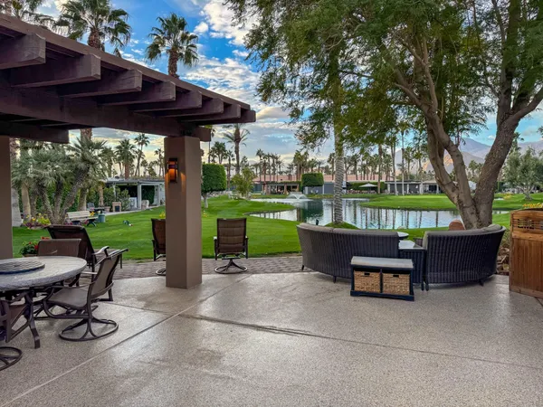a view of a sitting area with furniture and garden