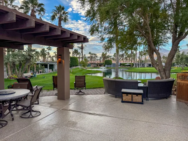 a view of a sitting area with furniture and garden