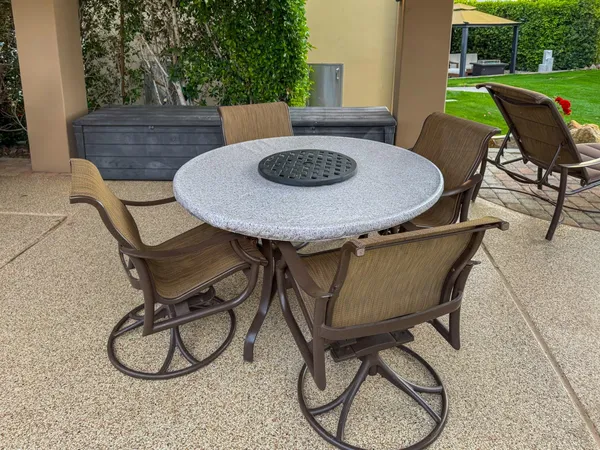 a outdoor dining space with furniture and garden