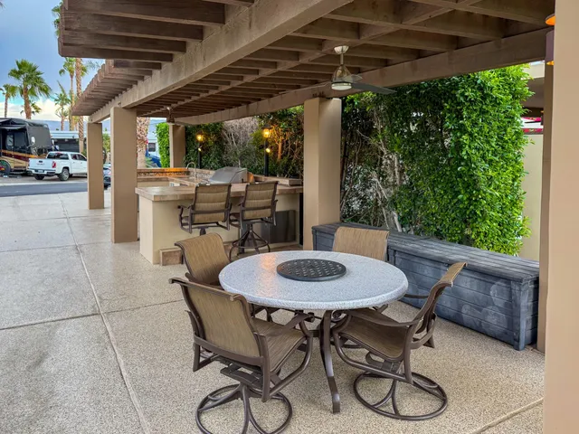 a table and chairs in a patio
