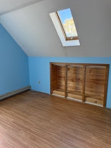 30 Groton Road Shirley, MA 01464 - Photo 19 of 25 a view of an empty room with wooden floor and windows