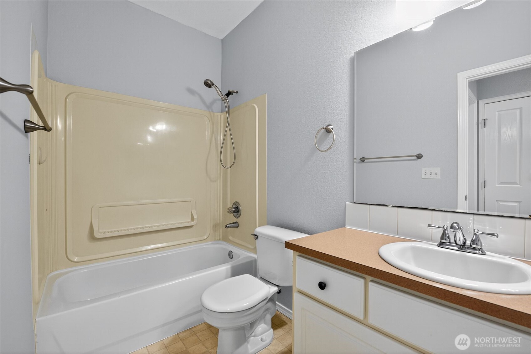 1680 Kennedy Place, Unit A4 DuPont, WA 98327 - Photo 21 of 24 a bathroom with a granite countertop sink toilet and shower