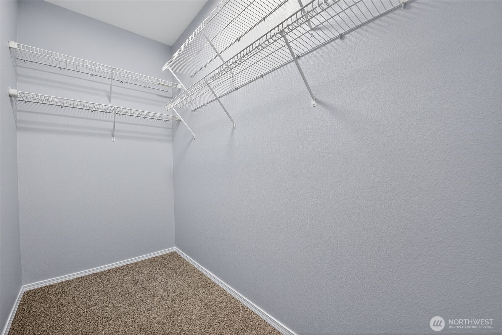 1680 Kennedy Place, Unit A4 DuPont, WA 98327 - Photo 22 of 24 a view of a room with racks on the wall