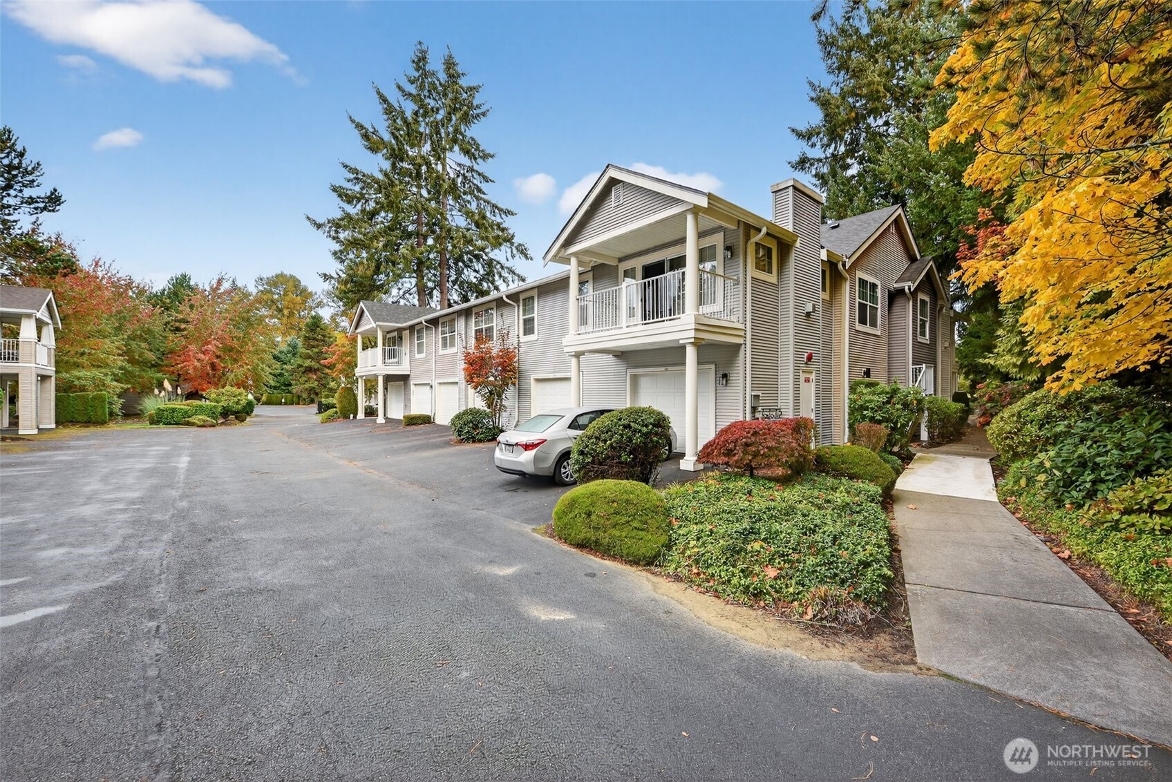 1680 Kennedy Place, Unit A4 DuPont, WA 98327 - Photo 23 of 24 a front view of a house with a yard and potted plants