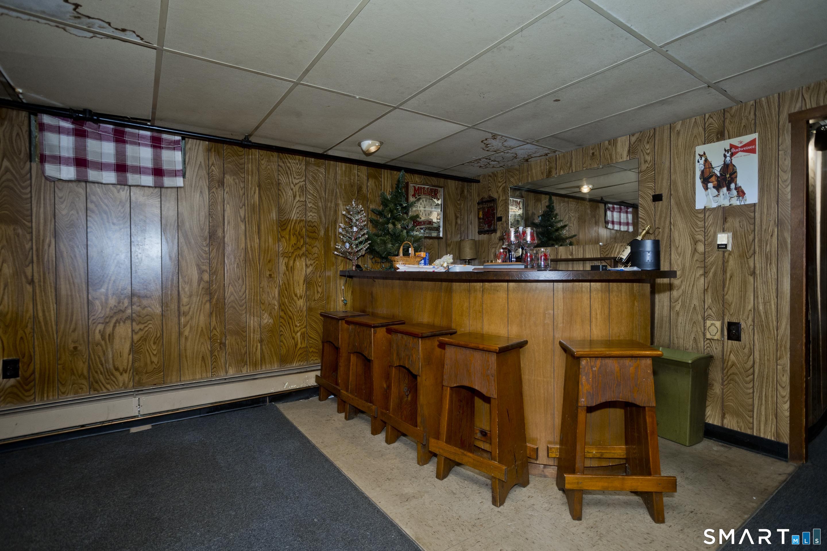 4 Fair Street Enfield, CT 06082 - Photo 23 of 28 Basement recreation area with bar