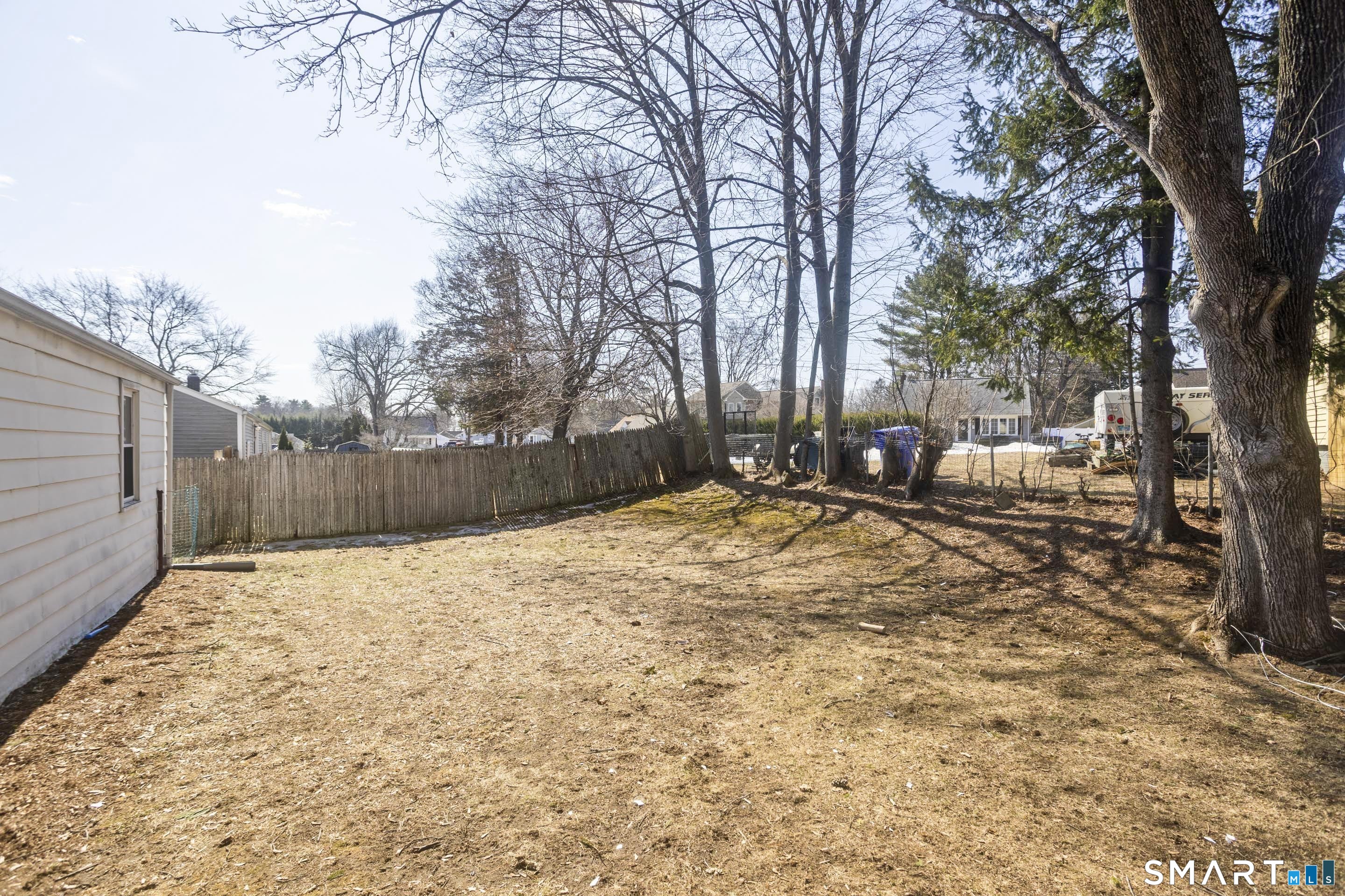 4 Fair Street Enfield, CT 06082 - Photo 25 of 28 Partially fenced backyard