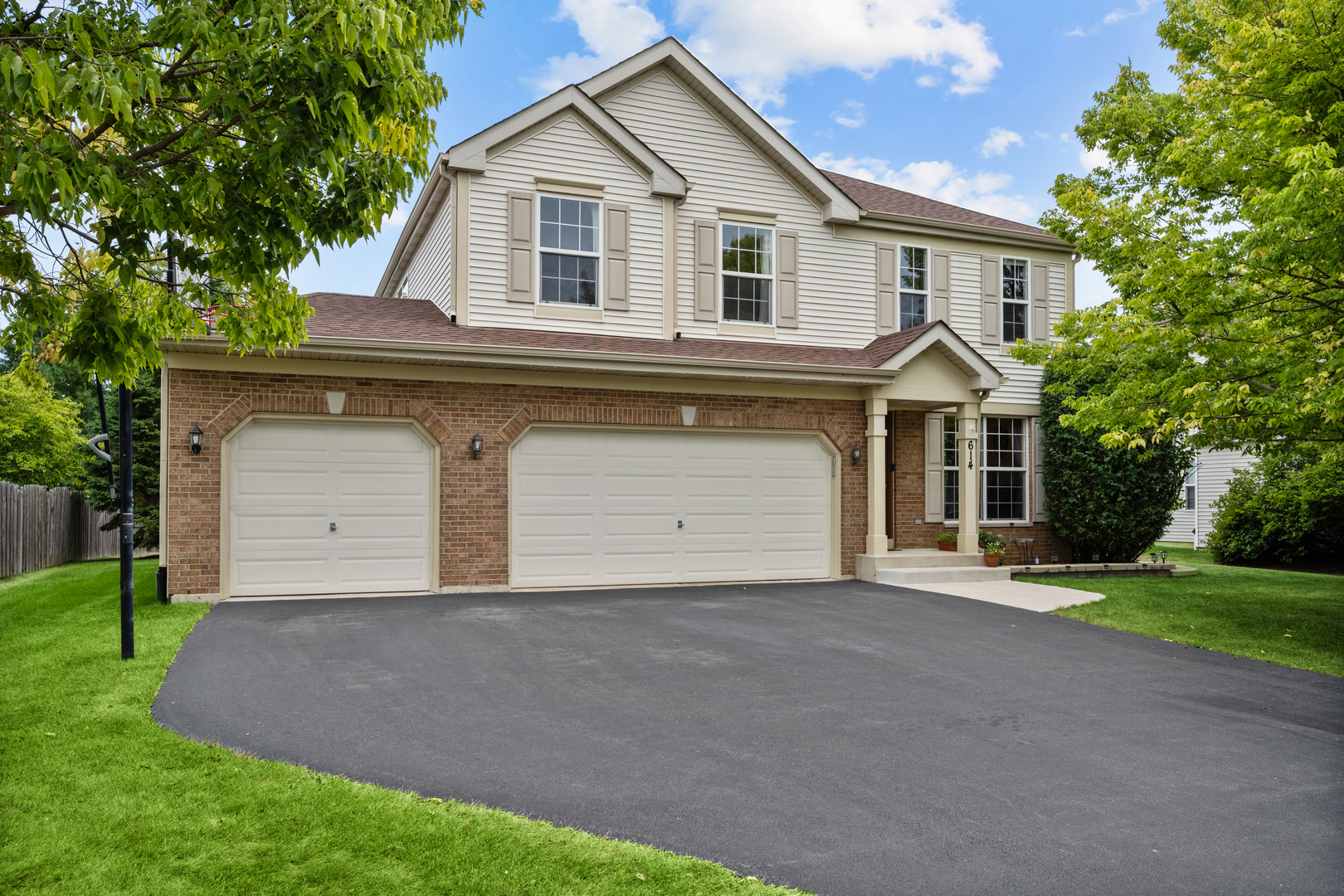 614 Wingpointe Drive Aurora, IL 60506 - Photo 1 of 31 a front view of a house with a yard and garage