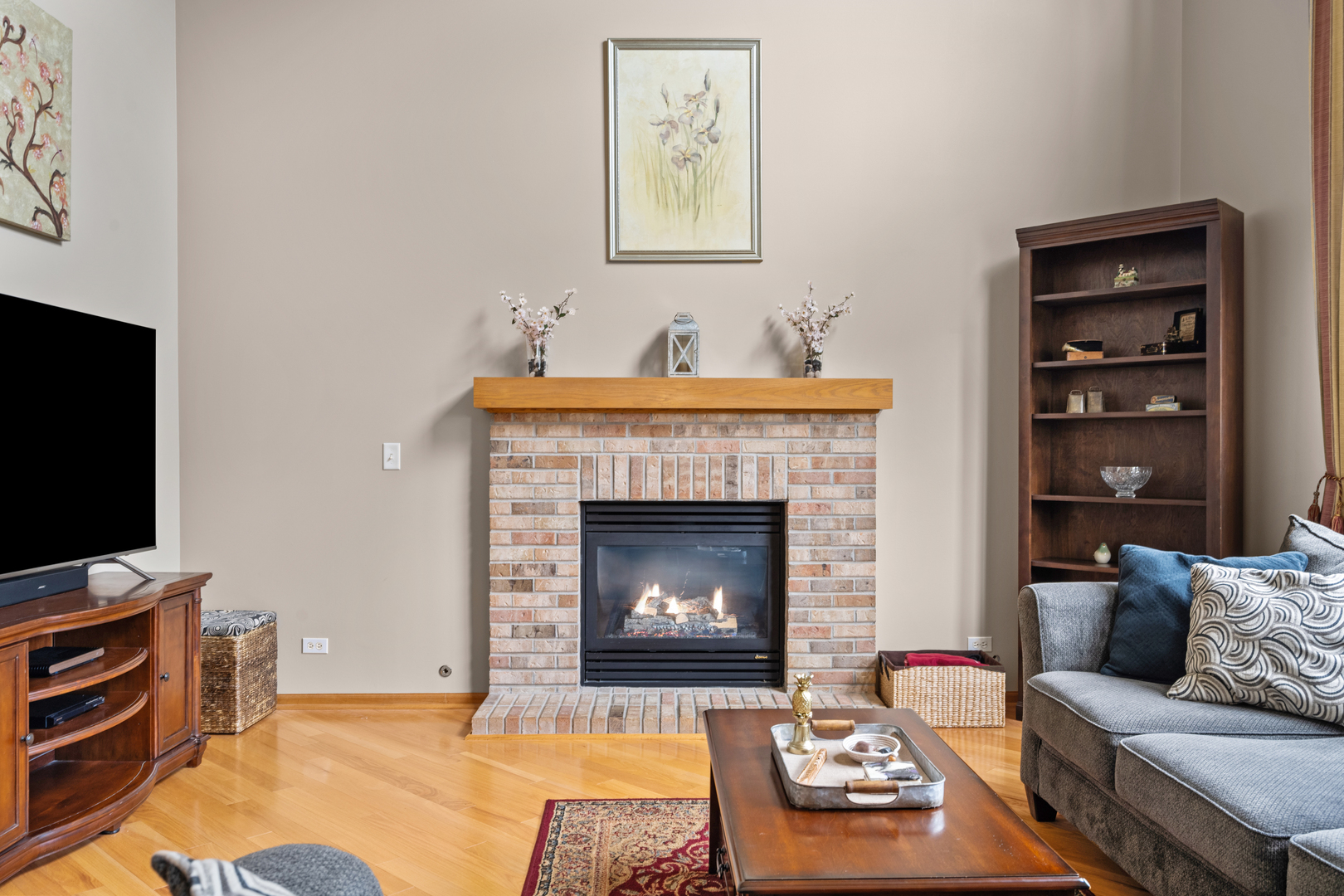 614 Wingpointe Drive Aurora, IL 60506 - Photo 12 of 31 a living room with furniture and a fireplace