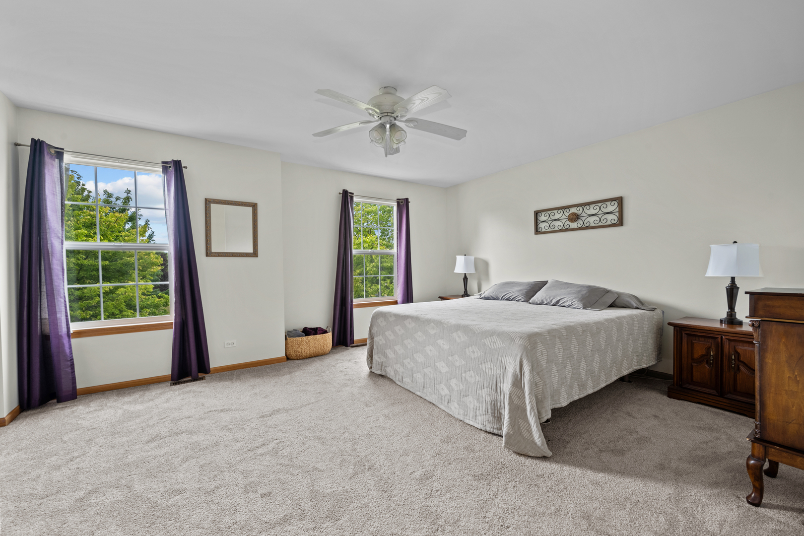 614 Wingpointe Drive Aurora, IL 60506 - Photo 18 of 31 a spacious bedroom with a bed and a large window