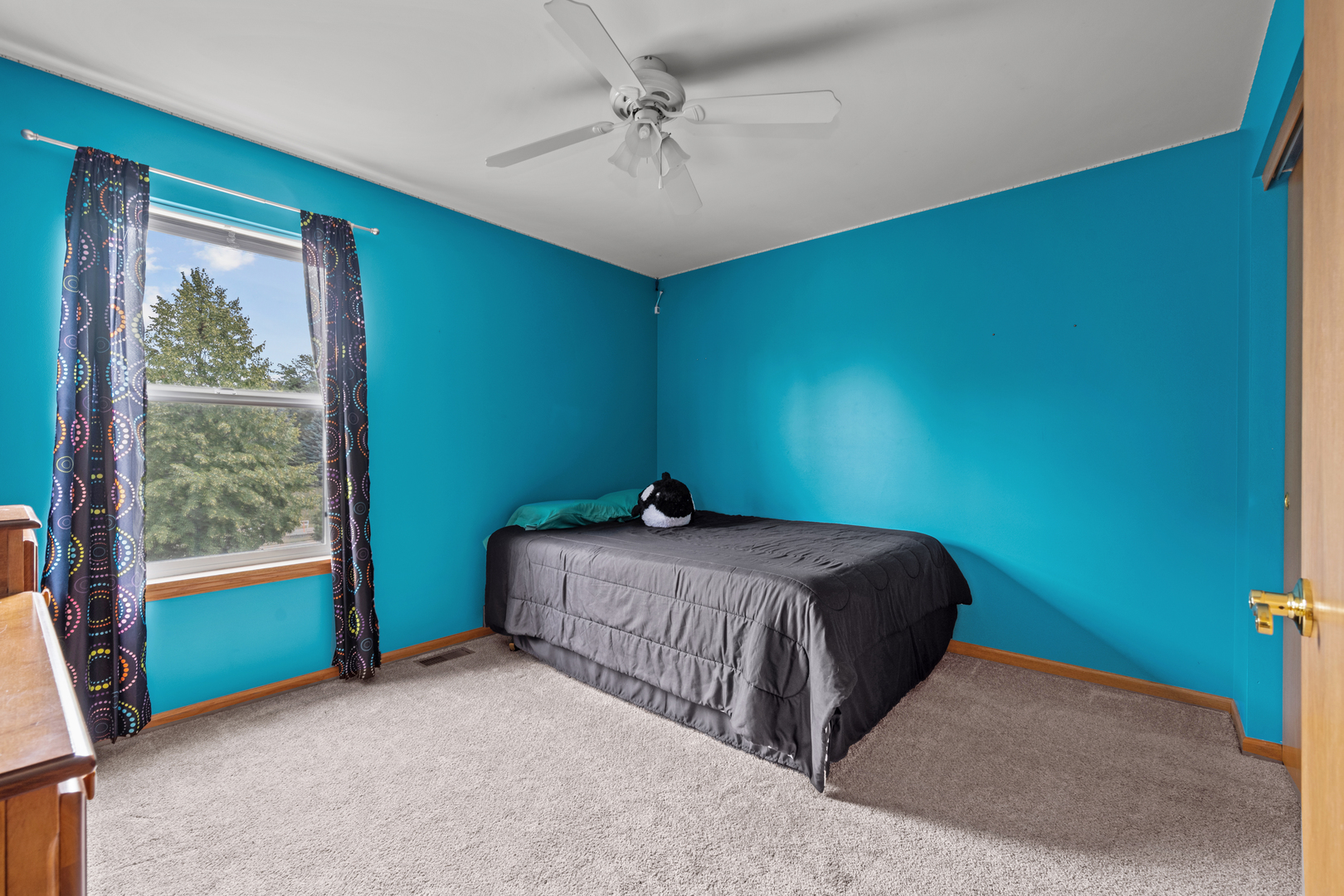 614 Wingpointe Drive Aurora, IL 60506 - Photo 22 of 31 a bed sitting in a bedroom next to a window