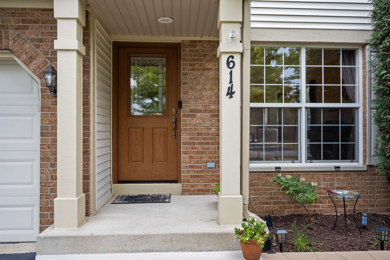614 Wingpointe Drive Aurora, IL 60506 - Photo 3 of 31 a front view of a house with a yard