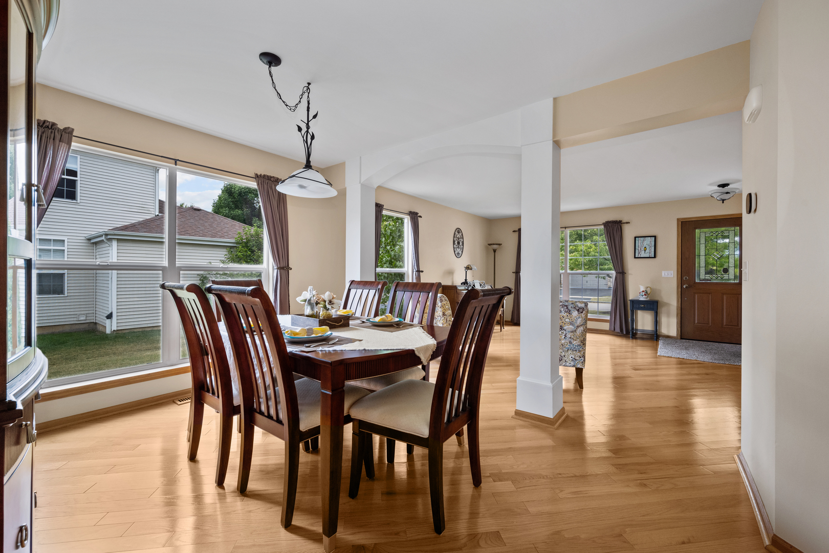 614 Wingpointe Drive Aurora, IL 60506 - Photo 6 of 31 a dining room with furniture window and wooden floor
