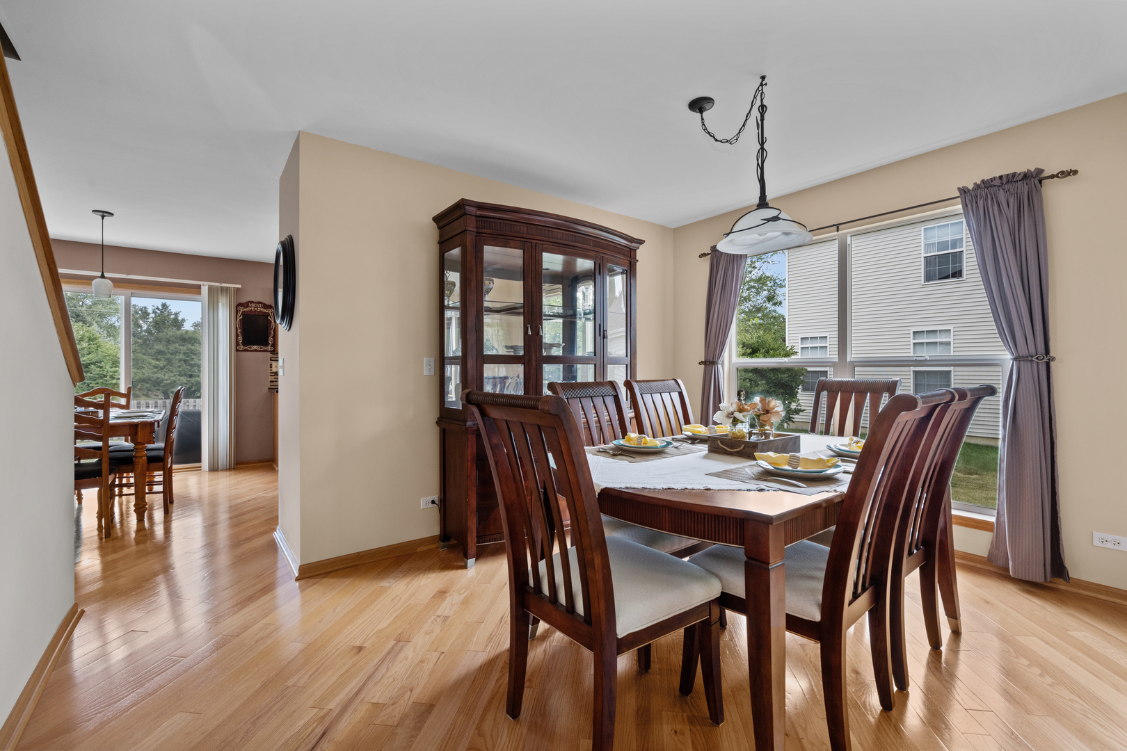 614 Wingpointe Drive Aurora, IL 60506 - Photo 7 of 31 a view of a dining room with furniture window and wooden floor
