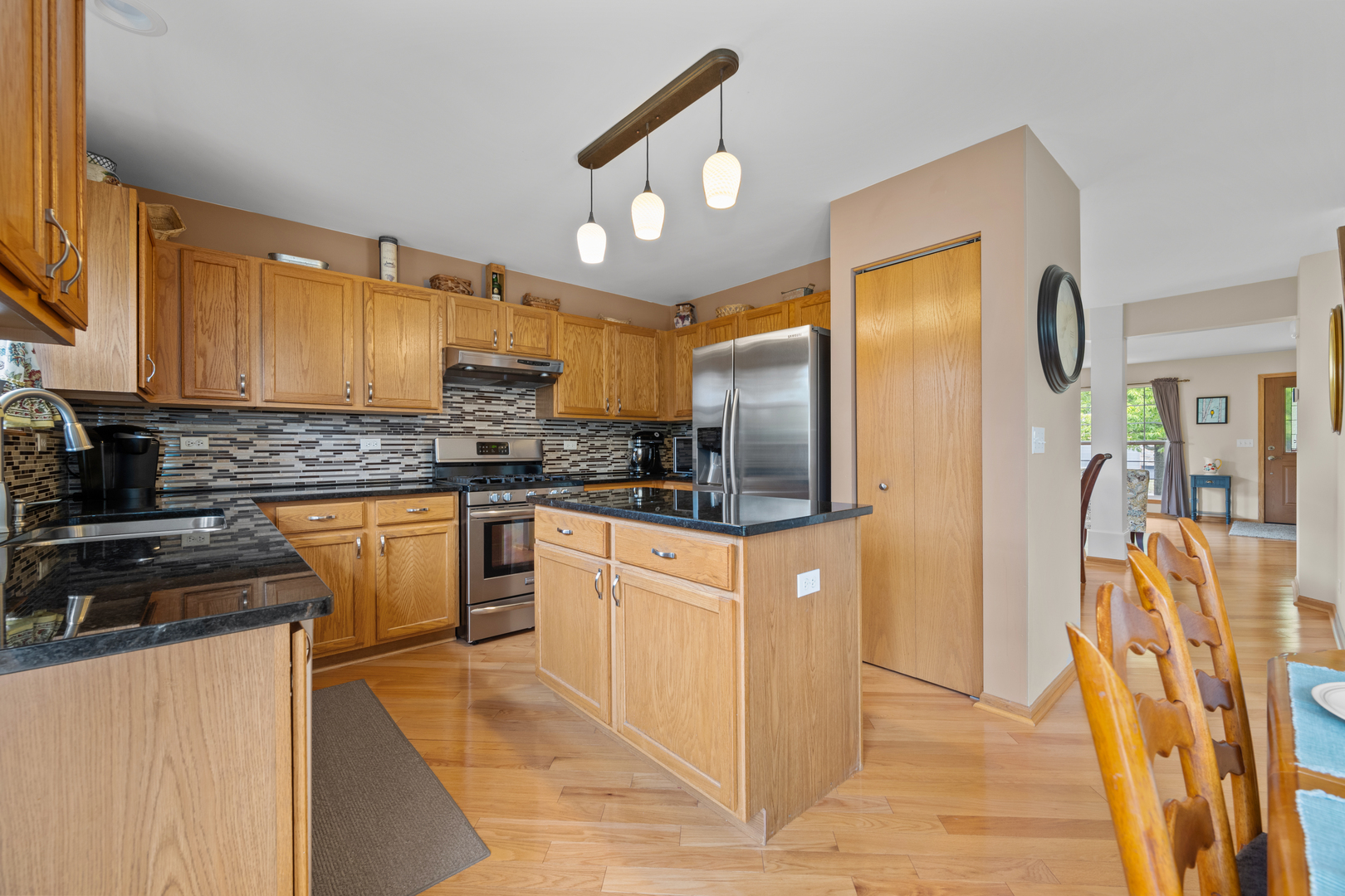 614 Wingpointe Drive Aurora, IL 60506 - Photo 10 of 31 a kitchen with stainless steel appliances granite countertop a refrigerator and a stove