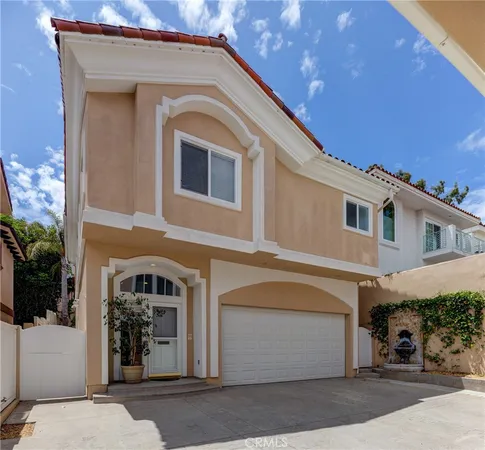 a front view of a house with a garage