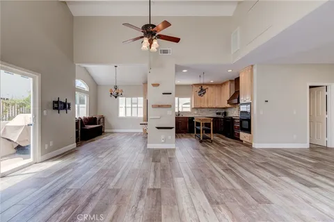 a living room with furniture and kitchen view