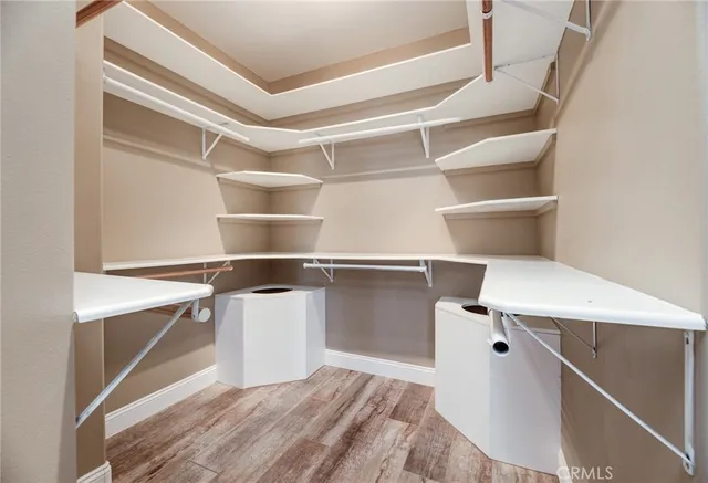 a room with a closet and wooden floor