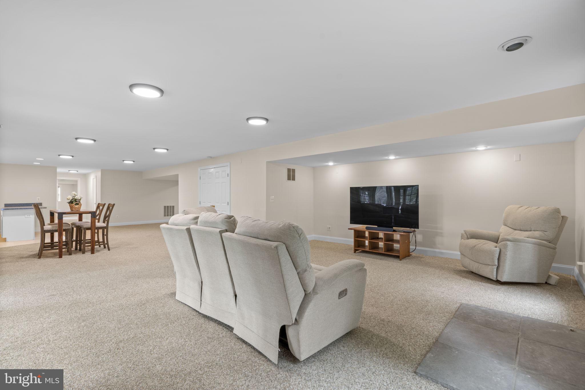 798 Creek View Road Severna Park, MD 21146 - Photo 50 of 72 a living room with furniture and a flat screen tv