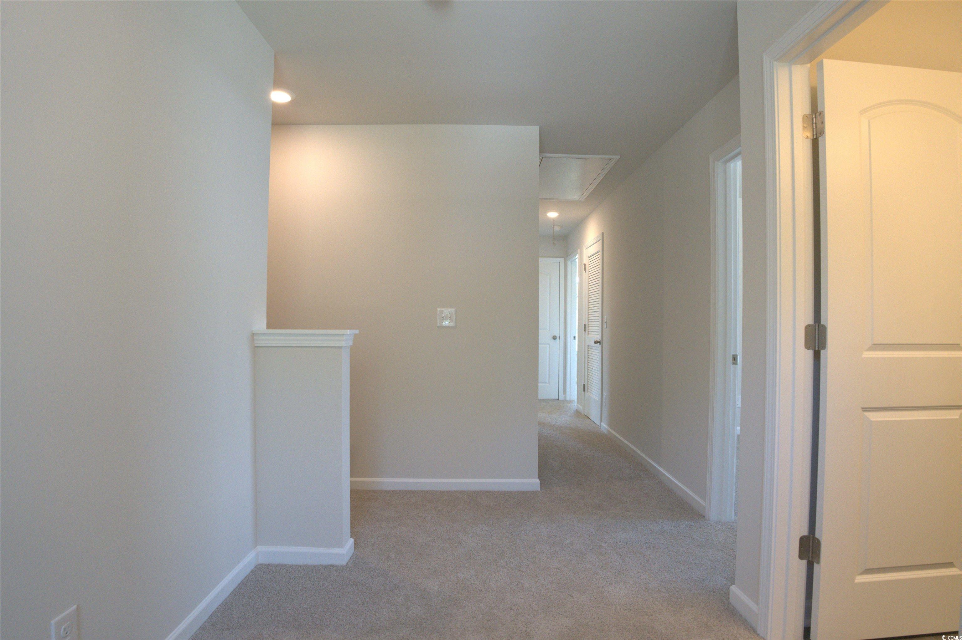 2654 Tansy Road Loris, SC 29569 - Photo 8 of 10 Hall with light carpet and recessed lighting