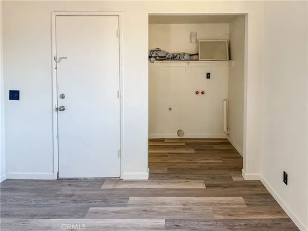 a view of a livingroom with wooden floor