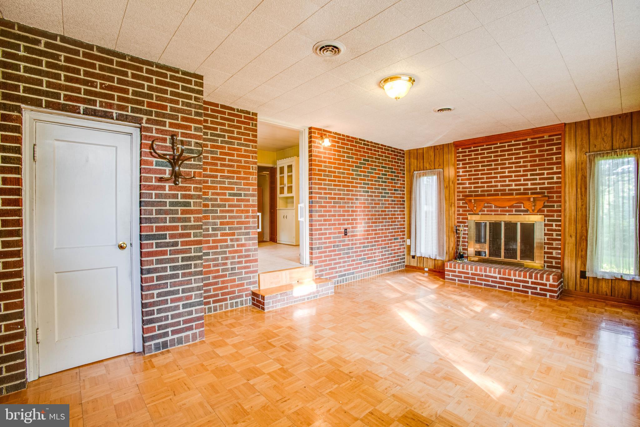11358 Ridge Road King George, VA 22485 - Photo 14 of 31 Family room; half bath on right